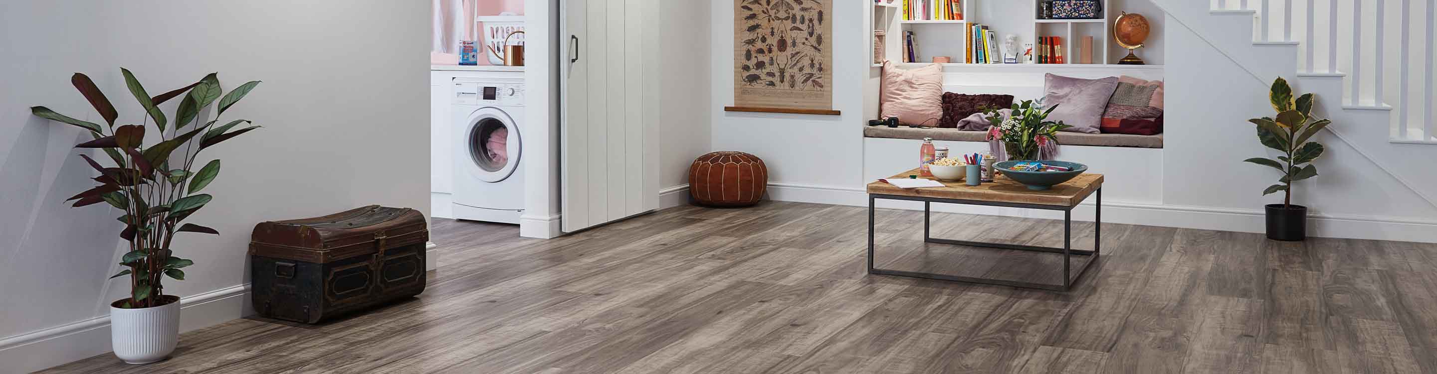 waterproof wood look vinyl flooring in modern basement playroom and laundry space